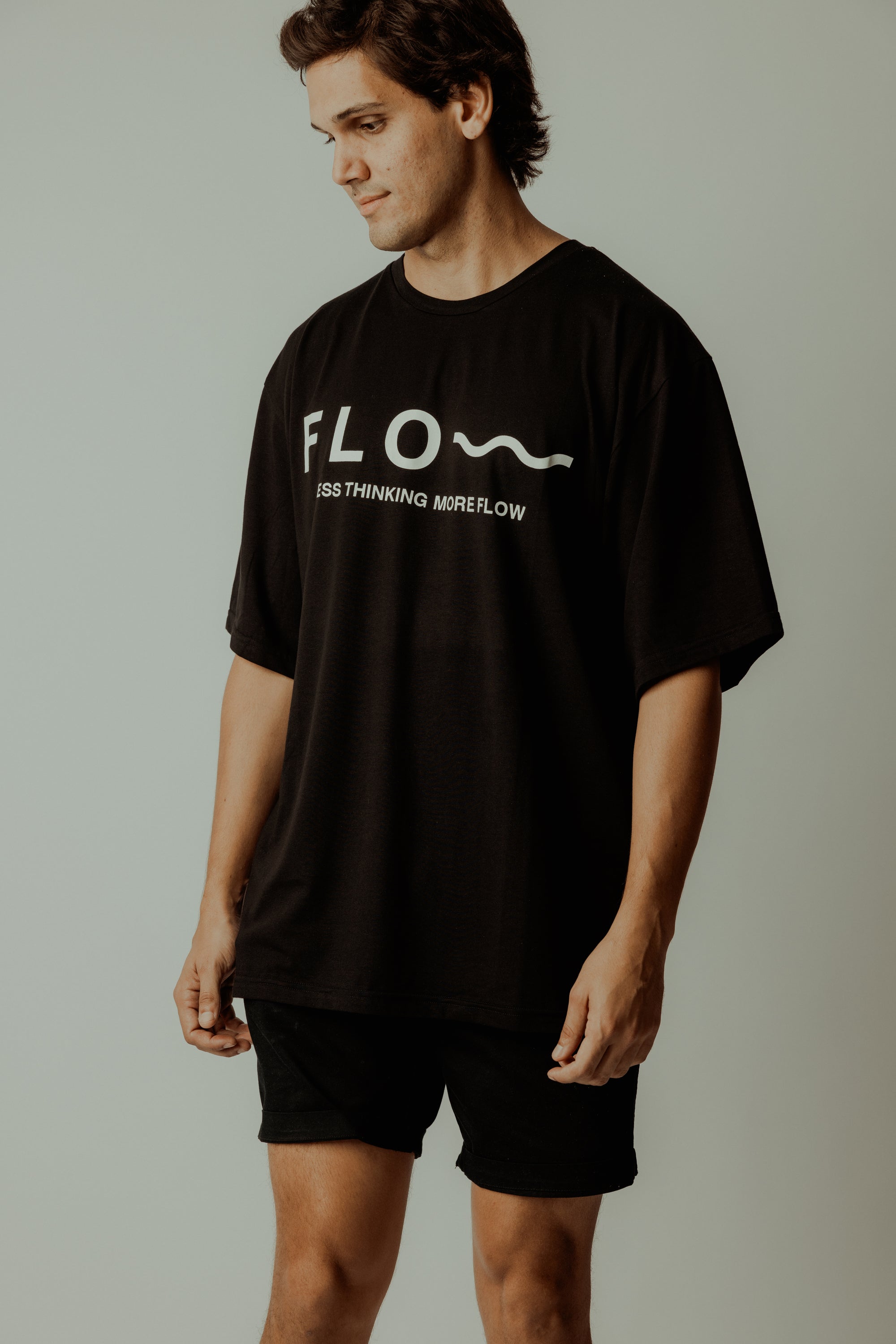 LESS THINKING MORE FLOW TEE BLACK