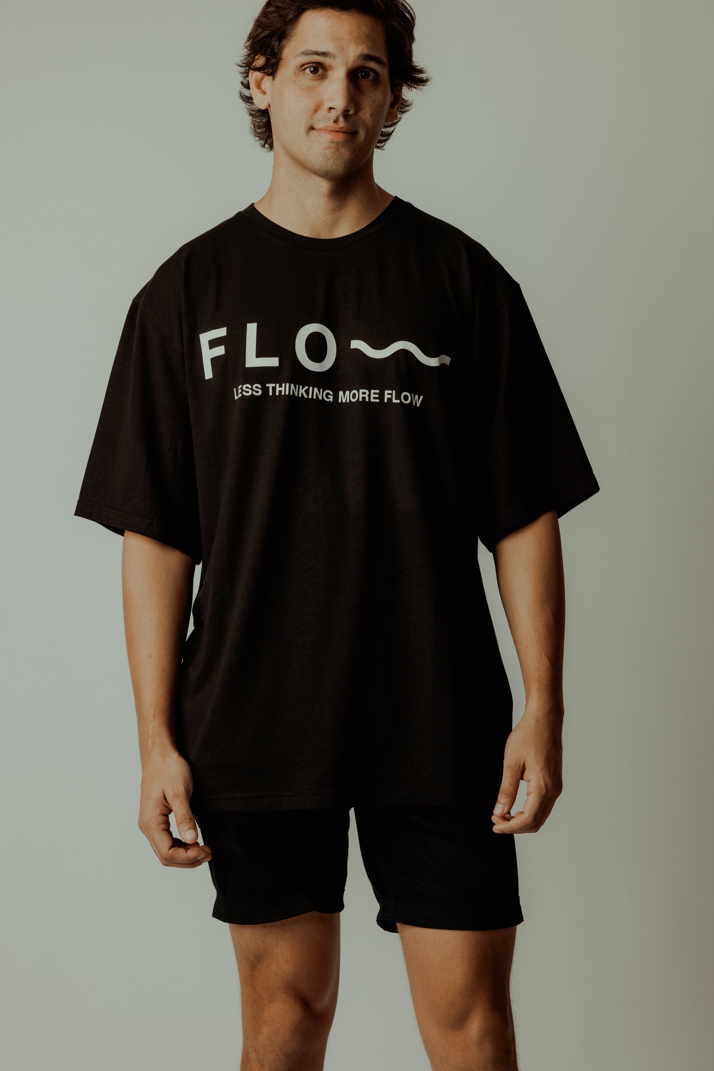 LESS THINKING MORE FLOW TEE BLACK